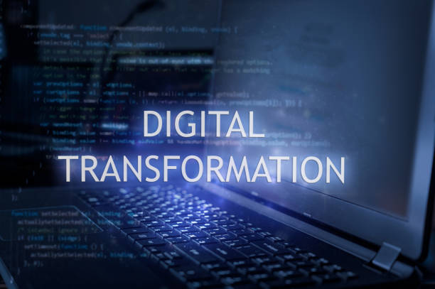 Digital transformation inscription against laptop and code background.