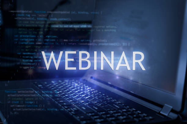 Webinar inscription against laptop and code background.