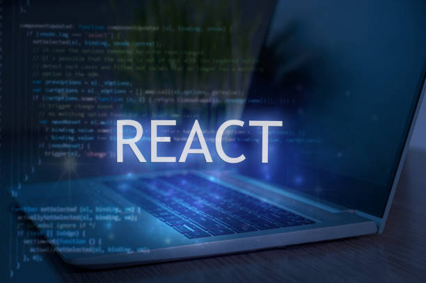 React inscription against laptop and code background.