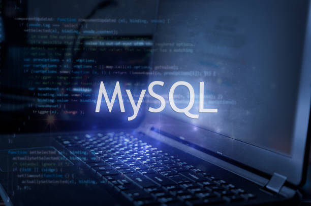 MySQL inscription against laptop and code background.