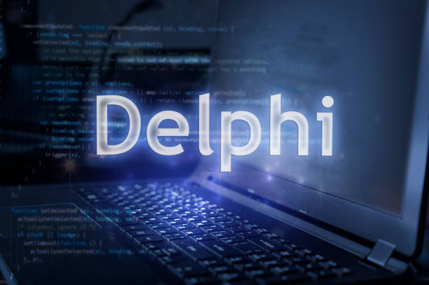 Delphi inscription against laptop and code background.