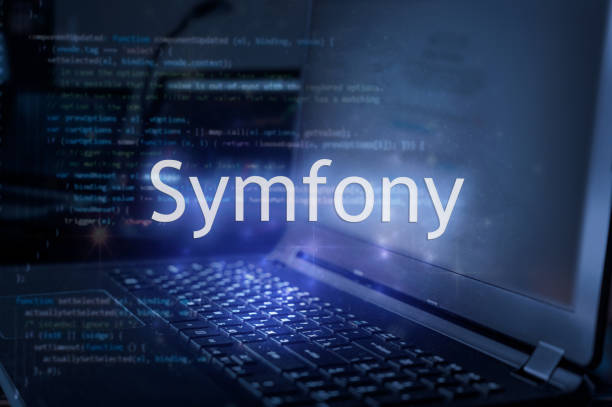 Symfony inscription against laptop and code background. Framework for web development.