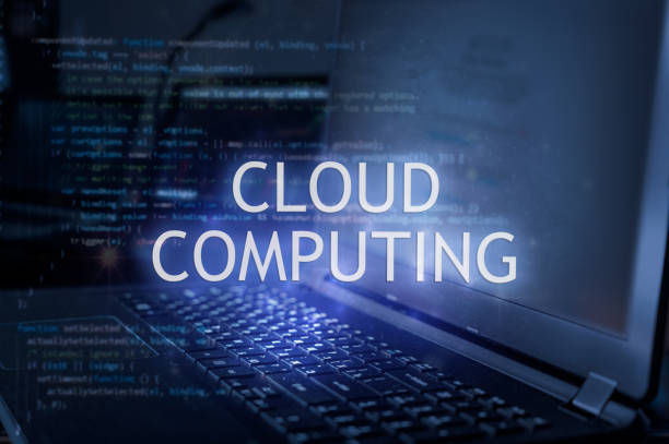 Cloud computing inscription against laptop and code background. Technology concept.